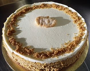 Pumpkin Cheesecake with a gingersnap crust and sour cream topping